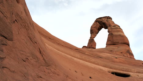 Delicate-Arch-in-Utah's-Arches-National-Park-crowns-the-crest-of-a-red-rock-ridge