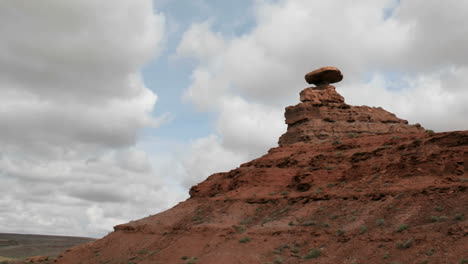 Storm-clouds-pass-over-a-small-rock-tower-in-Mexican-Hat-Canyon