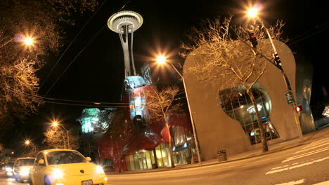 Accelerated-traffic-stops-and-then-blurs-into-streaks-of-light-in-front-of-the-Seattle-Space-Needle-and-surrounding-buildings