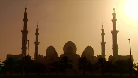 The-spires-and-minarets-of-the-beautiful-Sheikh-Zayed-Mosque-in-Abu-Dhabi-United-Arab-Emirates-at-sunset