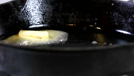 A-Tab-Of-Margarine-Containing-Trans-Fats-Melts-In-A-Hot-Skillet