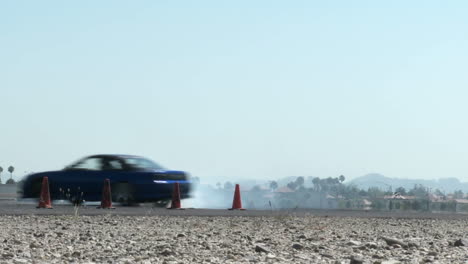 A-Car-Performs-A-Drifting-Maneuver-On-A-Test-Track