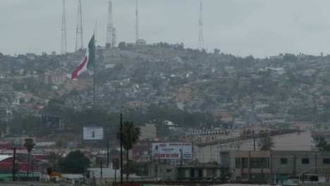 The-Mexican-Flag-Is-Seen-Waving-Above-Downtown-Tijuana-Mexico