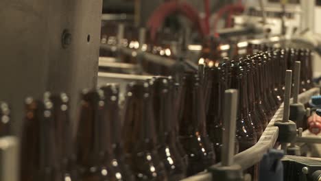 Bottles-Zip-Along-A-Conveyor-Belt-In-A-Bottling-Plant-6