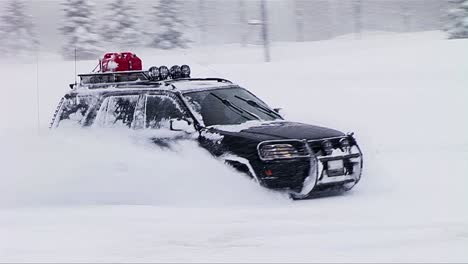 A-car-drives-and-does-spins-and-doughnuts-in-deep-snow
