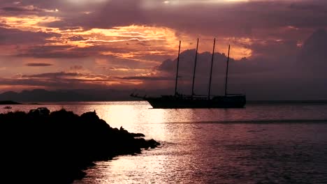 A-beautiful-sailing-ship-in-a-harbor-at-sunset