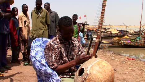 A-man-plays-a-beautiful-stringed-instrument-in-Mali-africa