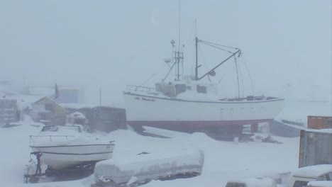 A-frozen-fishing-boat-sits-in-a-port-in-the-Arctic-during-winter