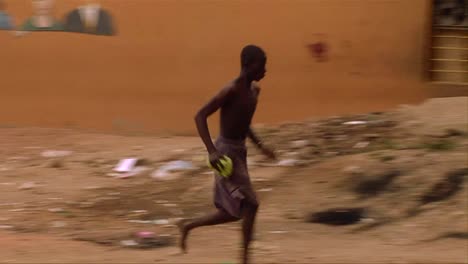 An-African-man-does-a-bizarre-stunt-by-running-up-to-a-wall-and-doing-a-flip