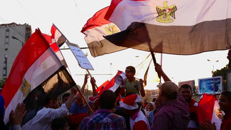 The-sun-shines-through-protestor\'s-flags-in-Cairo-Egypt