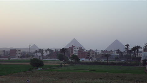 The-pyramids-of-Egypt-are-seen-in-the-distance-behind-the-Cairo-skyline