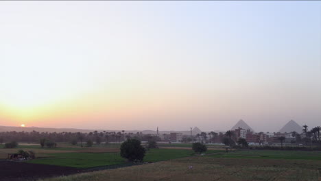 The-pyramids-of-Egypt-are-seen-at-a-distance-at-sunset