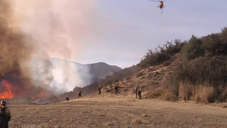 Firefighters-Look-On-As-A-Blaze-Burns-Out-Of-Control-In-California