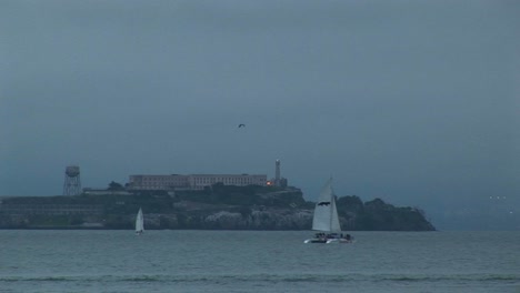 A-Catamaran-Glides-By-Historic-Alcatraz-Prison-On-A-Foggy-Day
