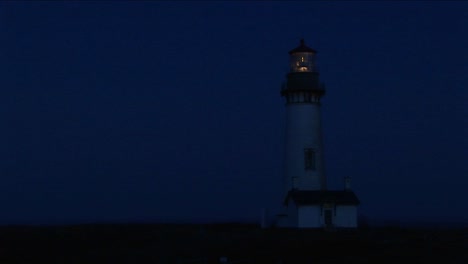 A-Lighthouse-At-Night-With-Its-Flashing-Light