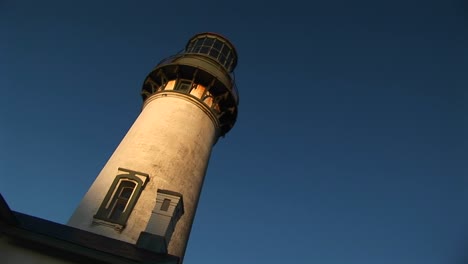 A-Montage-Of-An-Old-Lighthouse-At-A-Jaunty-Angle-In-The-Sunlight