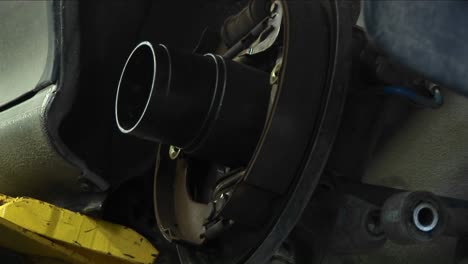 Closeup-Of-A-Mechanic-Works-On-A-Wheel-Repair