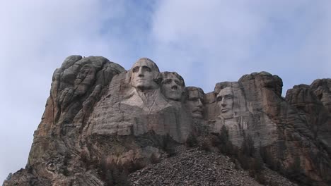 Clouds-Drift-Slowly-Past-The-Tops-Of-The-Four-Presidents-In-This-Longshot-Of-Mt-Rushmore
