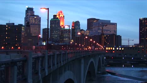 Mediumwideshot-Of-Minneapolis-Minnesota-Skyline-From-The-Mississippi-River-During-The-Goldenhour