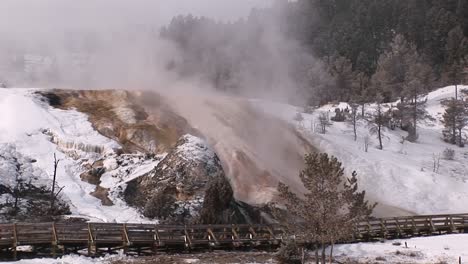 Mist-Rises-From-Yellowstone-National-Park'S-Hot-Springs'-Terraces-In-Winter
