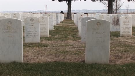 The-Camera-Pans-An-Old-Military-Cemetery-With-White-Headstones-Arranged-In-Precise-Rows