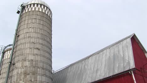Wormseye-View-Of-A-Farm-Silo-And-Barn-Roof