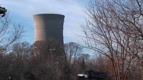 The-Camera-Pans-From-The-Front-Porch-Of-A-Residential-Home-To-A-Nuclear-Power-Plant-Located-Nearby
