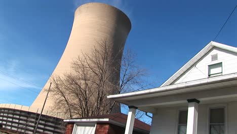 The-Huge-Cone-Of-A-Nuclear-Power-Plant-Looms-Above-A-Home