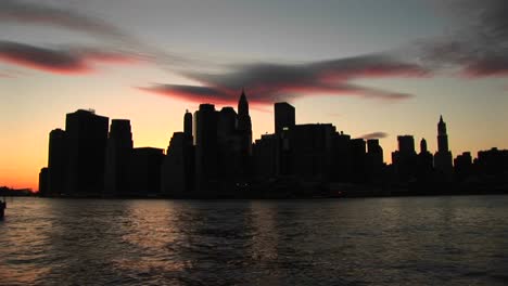 The-River-Reflects-The-Last-Rays-Of-Sunlight-In-This-New-York-City-Skyline-Shot
