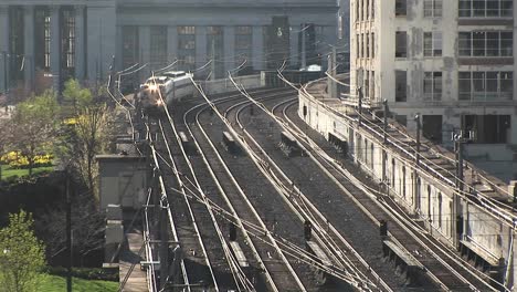 One-Of-Chicago'S-Famed-Els""-Rounds-A-Corner-And-Heads-Down-The-Elevated-Tracks-Past-Nondescript-Buildings""