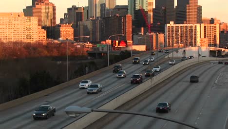 The-Camera-Pans-Up-From-A-Divided-Highway-To-Chicago'S-Skyline-At-The-Golden-Hour