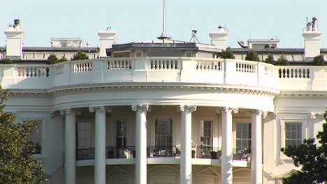 The-Camera-Pansup-The-White-House-To-The-Large-Flagpole-Of-The-Roof