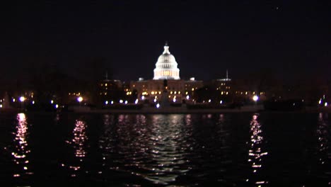 The-Capitol-Dome-Is-Illuminated-As-A-Reflecting-Pool-Shimmers-Below