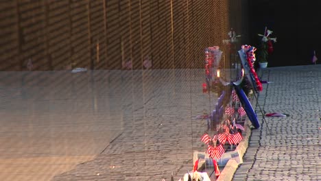 In-Front-Of-The-Vietnam-Veterans-Memorial-Wall-Ribbons-On-Tributes-And-Mementos-Flutter-In-The-Breeze