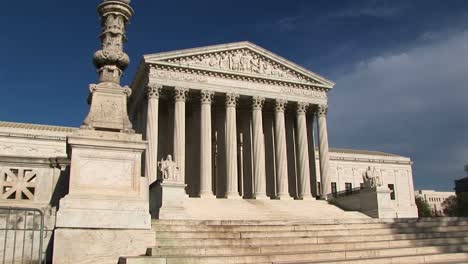 Sunlight-Reflects-On-The-White-Stone-Steps-And-Bright-White-Pillars-Of-The-Us-Supreme-Court-Building-Entrance