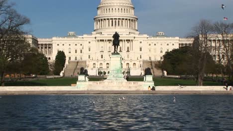 Panning-Up-From-The-Reflecting-Pool-In-Washington-Dc-And-Focusing-On-The-Us-Capitol-Building
