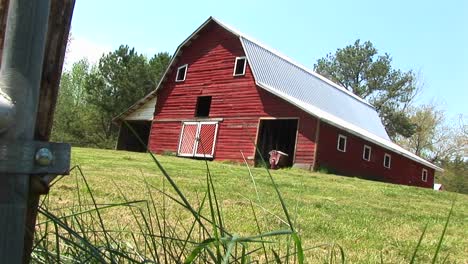 A-Lovely-Old-Red-Barn-Sits-On-Top-Of-A-Hill