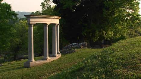 Four-Stately-Architectural-Columns-Grace-A-Manicured-Hillside