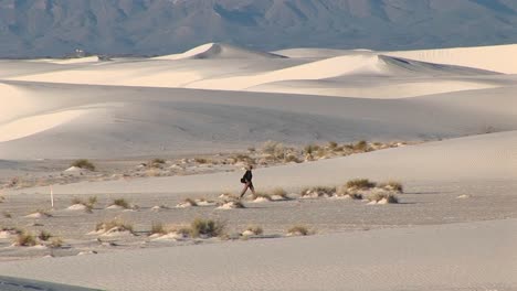 Longshot-Of-A-Hiker-Walking-Through-White-Sands-National-Monument-In-New-Mexico