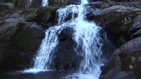 Pan-Up-Shot-Of-A-Waterfall-In-The-Blue-Ridge-Mountains