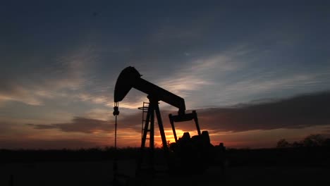 Medium-Shot-Of-A-Silhouetted-Oil-Pump-Turning-In-The-New-Mexico-Desert-5