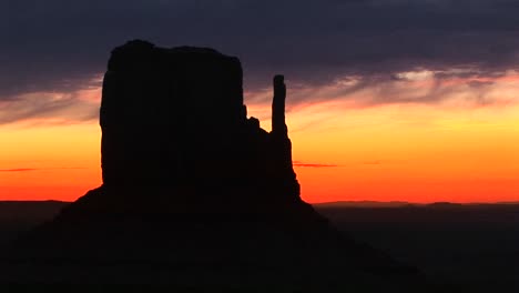 Medium-Shot-Of-Left-Mitten-In-Monument-Valley-Arizona-Silhouetted-At-Goldenhour