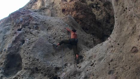 Panright-Of-A-Rock-Climber-Scaling-A-Cliff-Wall