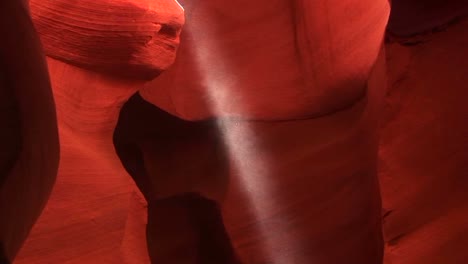 Panup-Of-As-A-Shaft-Of-Light-Illuminates-The-Red-Rock-Walls-Of-A-Enclosed-Geological-Formation-In-Antelope-Canyon-Arizona