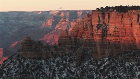 Wide-Shot-Of-Grand-Canyon-National-Park-With-The-Layered-Cliffs-Of-The-North-Rim-Canyon-Wall-Soaring-Above-Winter-Snow