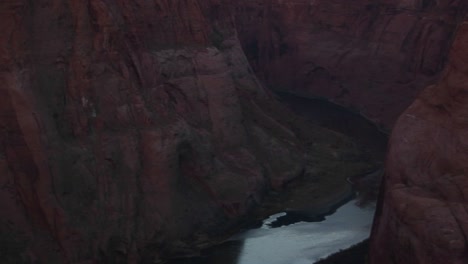 Panning-Up-From-Frozen-Colorado-Río-And-Sandstone-Canyon-Cliffs-To-Full-Moon-Over-Distant-Plateau