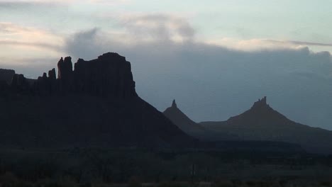 Long-Shot-Of-The-Peak-Of-A-Silhouetted-North-Sixshooter-In-Canyonlands-National-Park-Utah