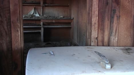 Mediumshot-Of-The-Interior-Of-An-Old-Abandoned-Farm-House-In-The-Utah-Desert