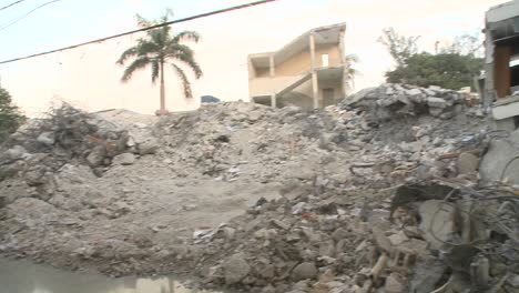 Medics-stand-amongst-the-rubble-following-the-Haiti-earthquake