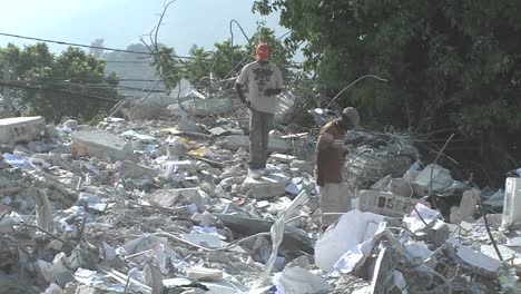 Workers-search-among-piles-of-rubble-after-the-Haiti-earthquake